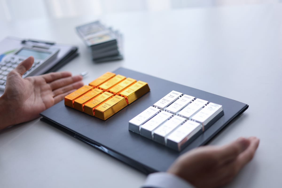 Man investing in precious metals gold and silver